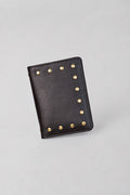 Dark brown leather Amaretto passport case by Violeta with gold studs, front view