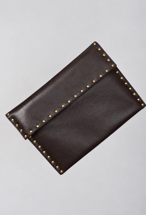 Dark brown leather Amaretto laptop case by Violeta with gold stud trim, front view showing the flap