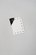 Black and white Cowhide passport case by Violeta with silver studs, front view